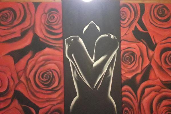 female figure among the roses